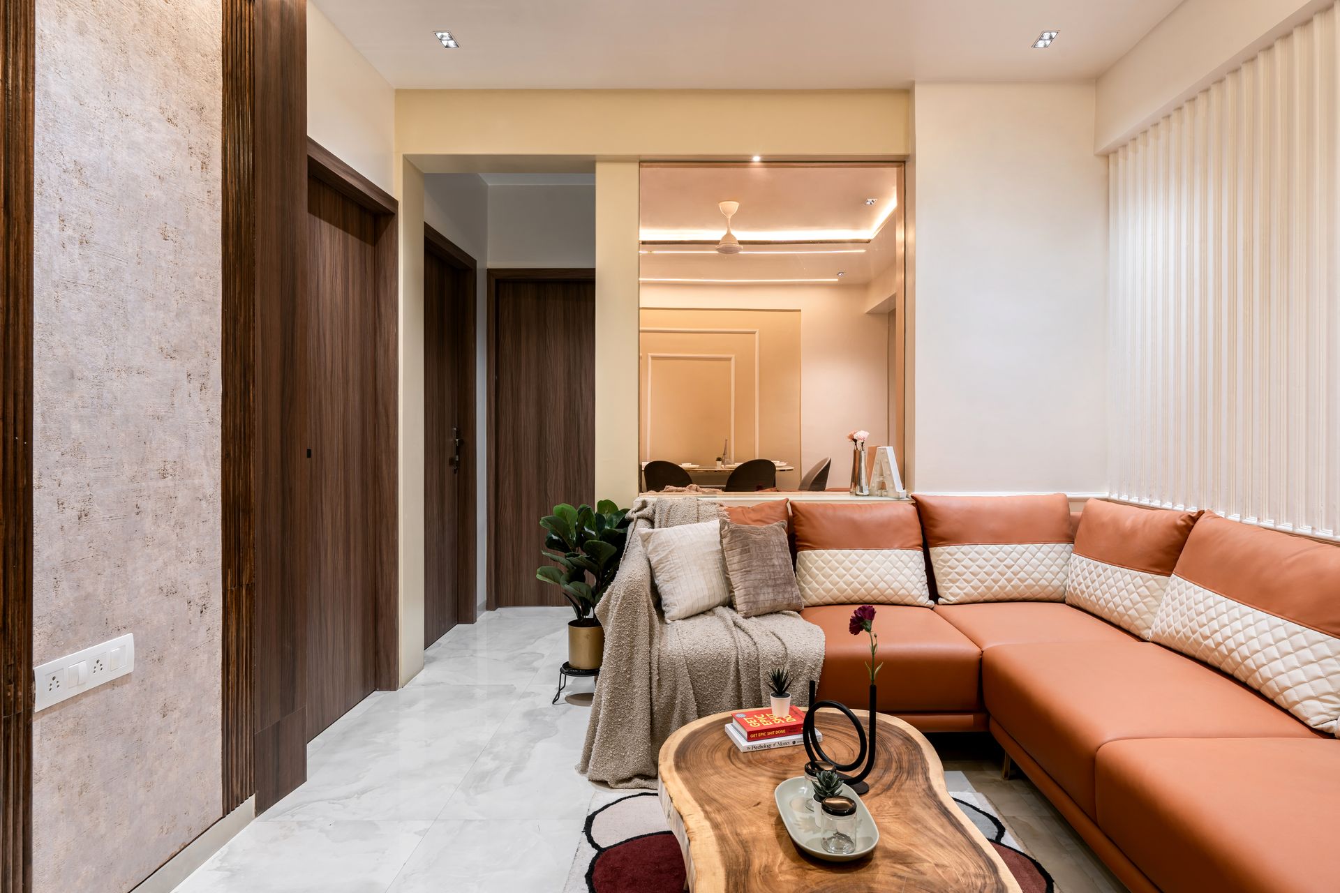 Living room · terracotta sectional and walnut panelling