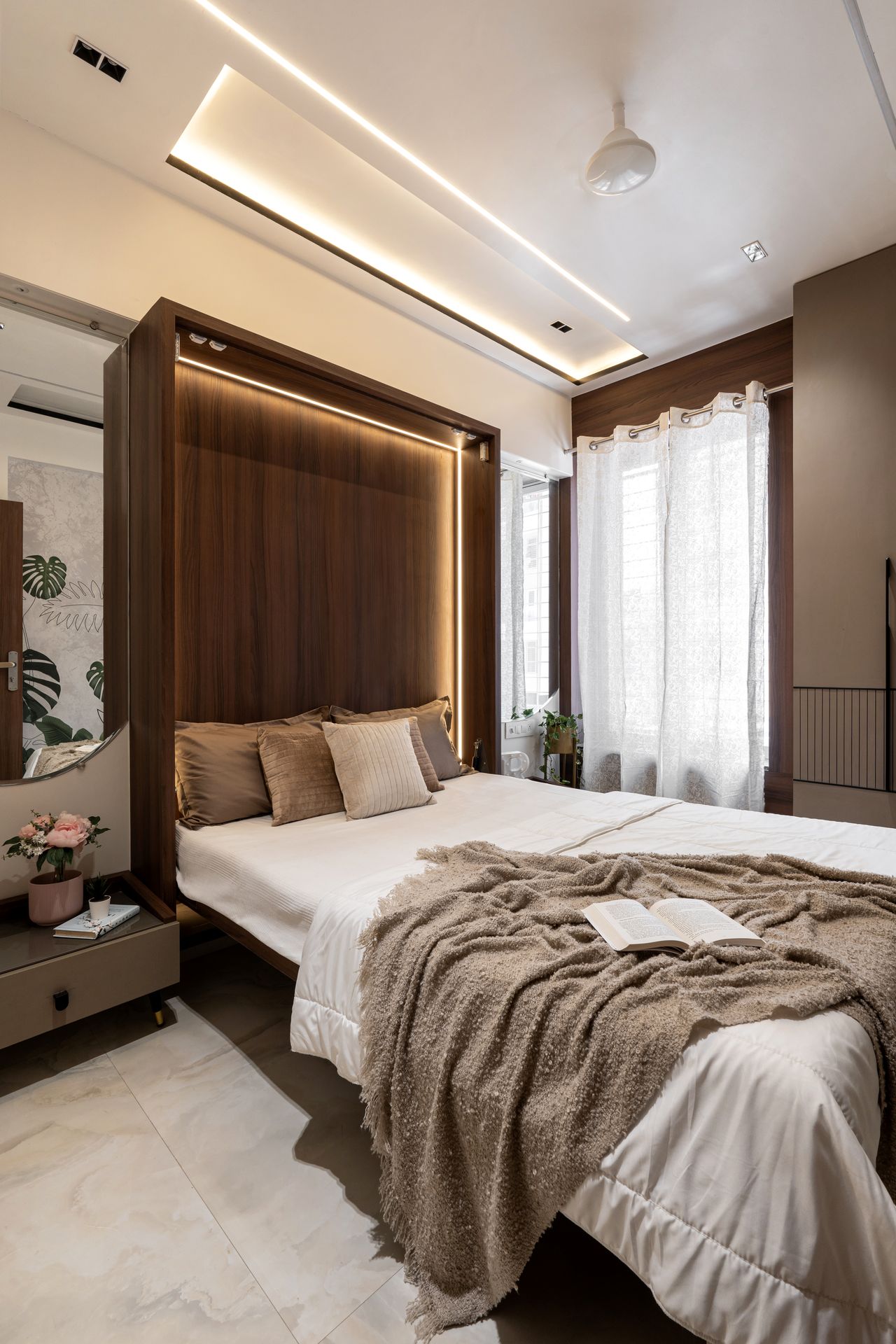 Master bedroom with walnut panel and cove lighting