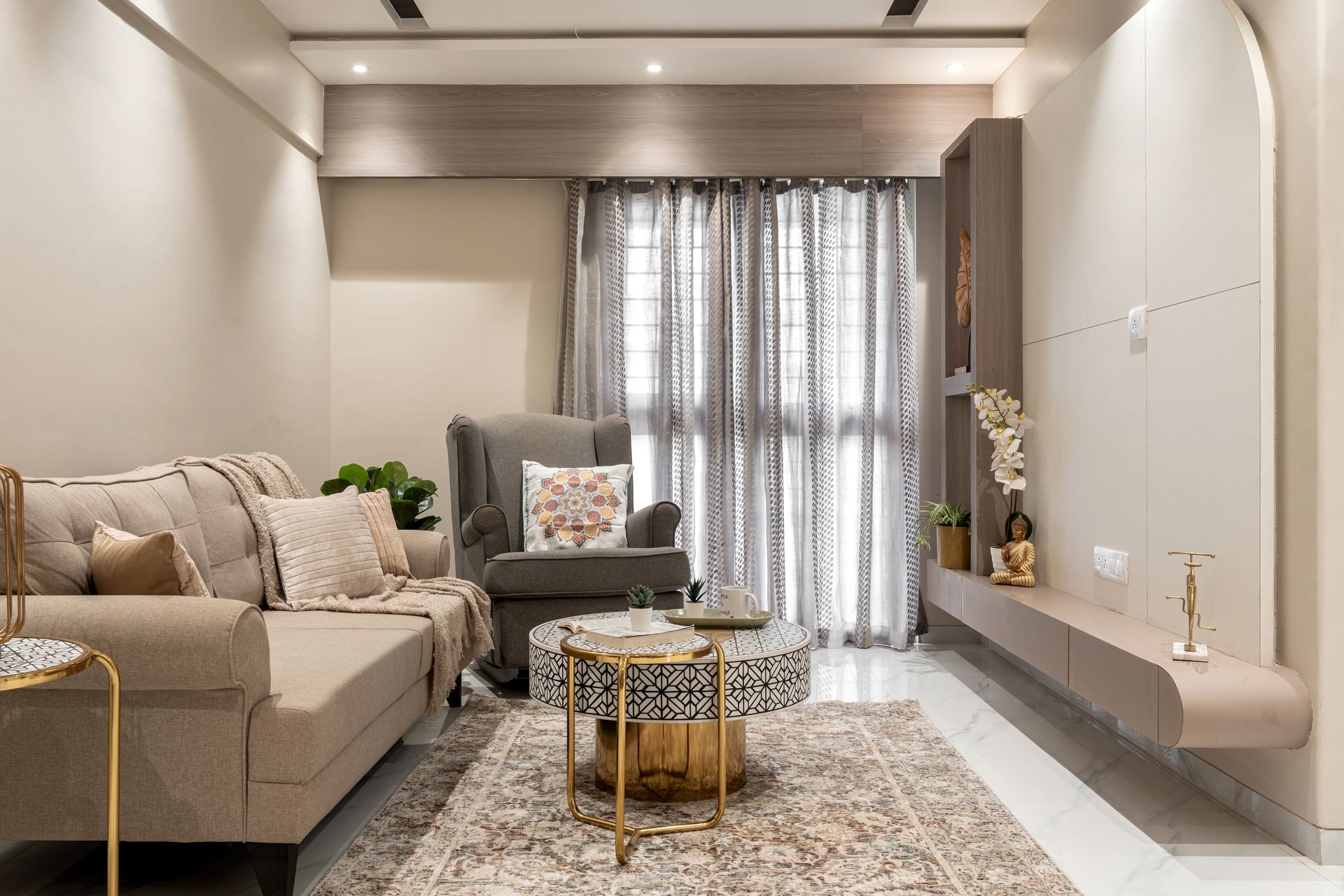 Soft neutral living room with arched TV wall